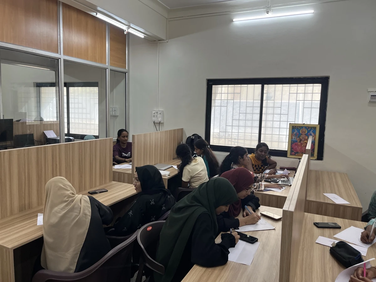 Learners at desks in the existing learning studio